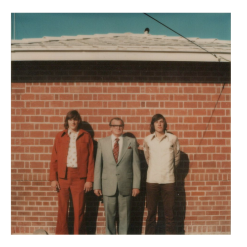 Greg, Bernard and Tim Moran posing outside